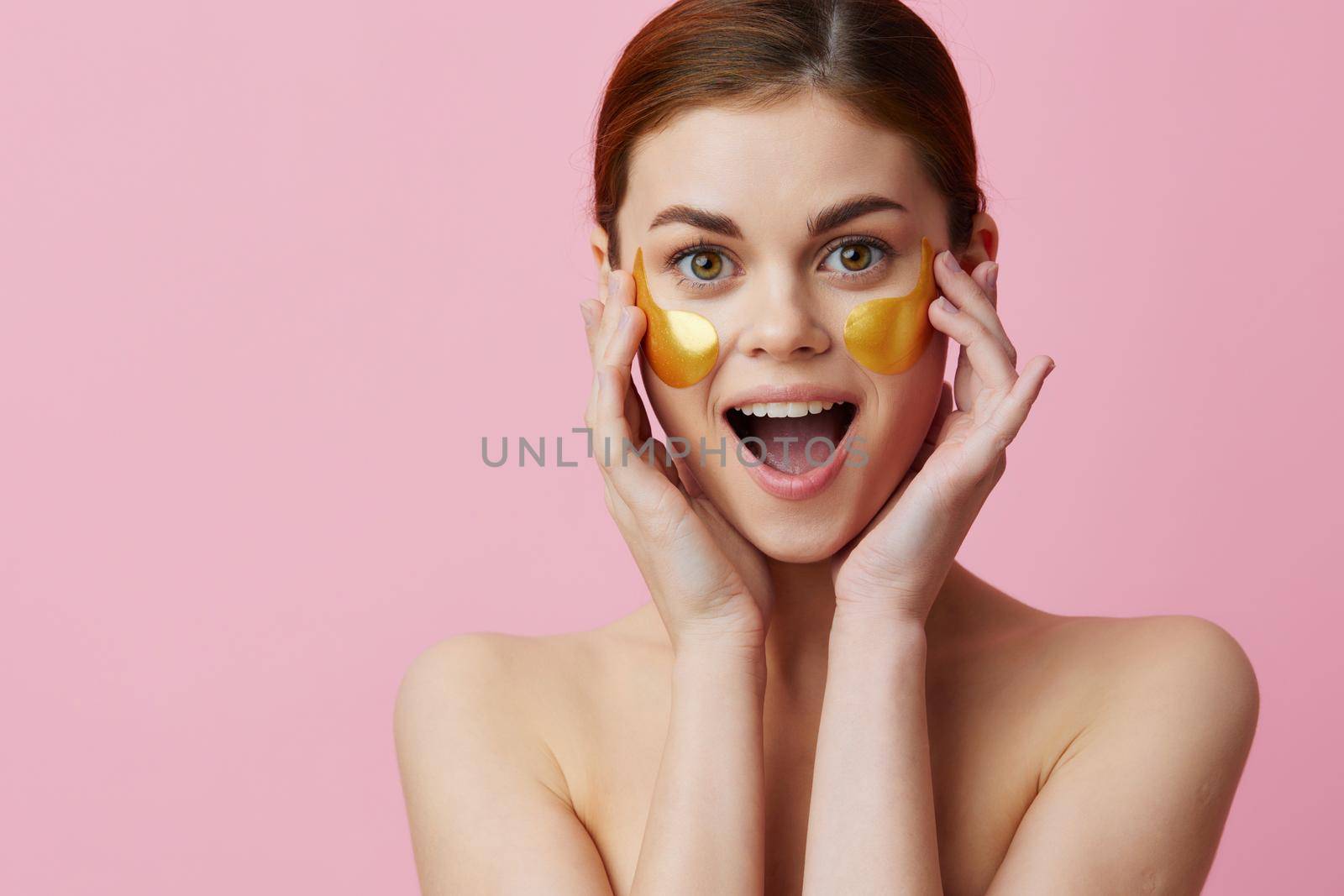 young woman golden patches clean skin smile posing isolated background by SHOTPRIME