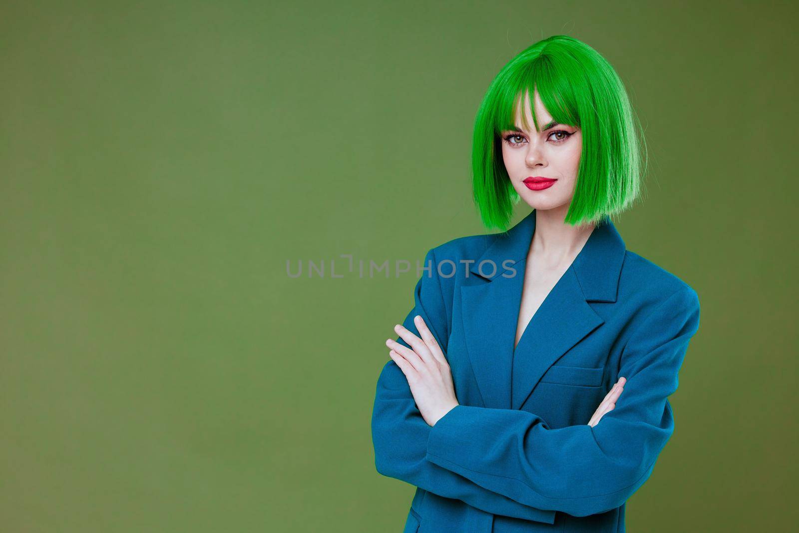 Pretty young female Glamor green wig red lips blue jacket green background unaltered by SHOTPRIME