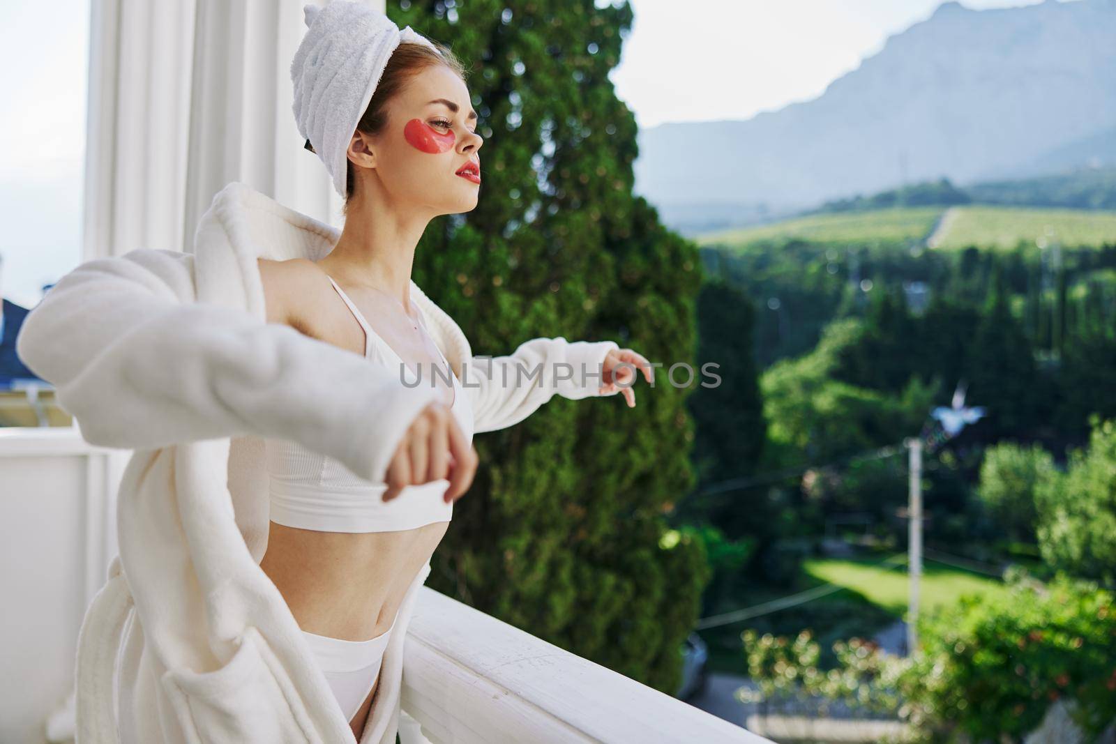 Sensual and beautiful woman enjoying at hotel terrace on sunny day Relaxation concept by SHOTPRIME