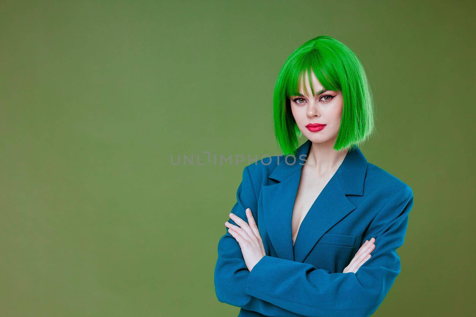 Beautiful fashionable girl attractive look green wig blue jacket posing color background unaltered by SHOTPRIME