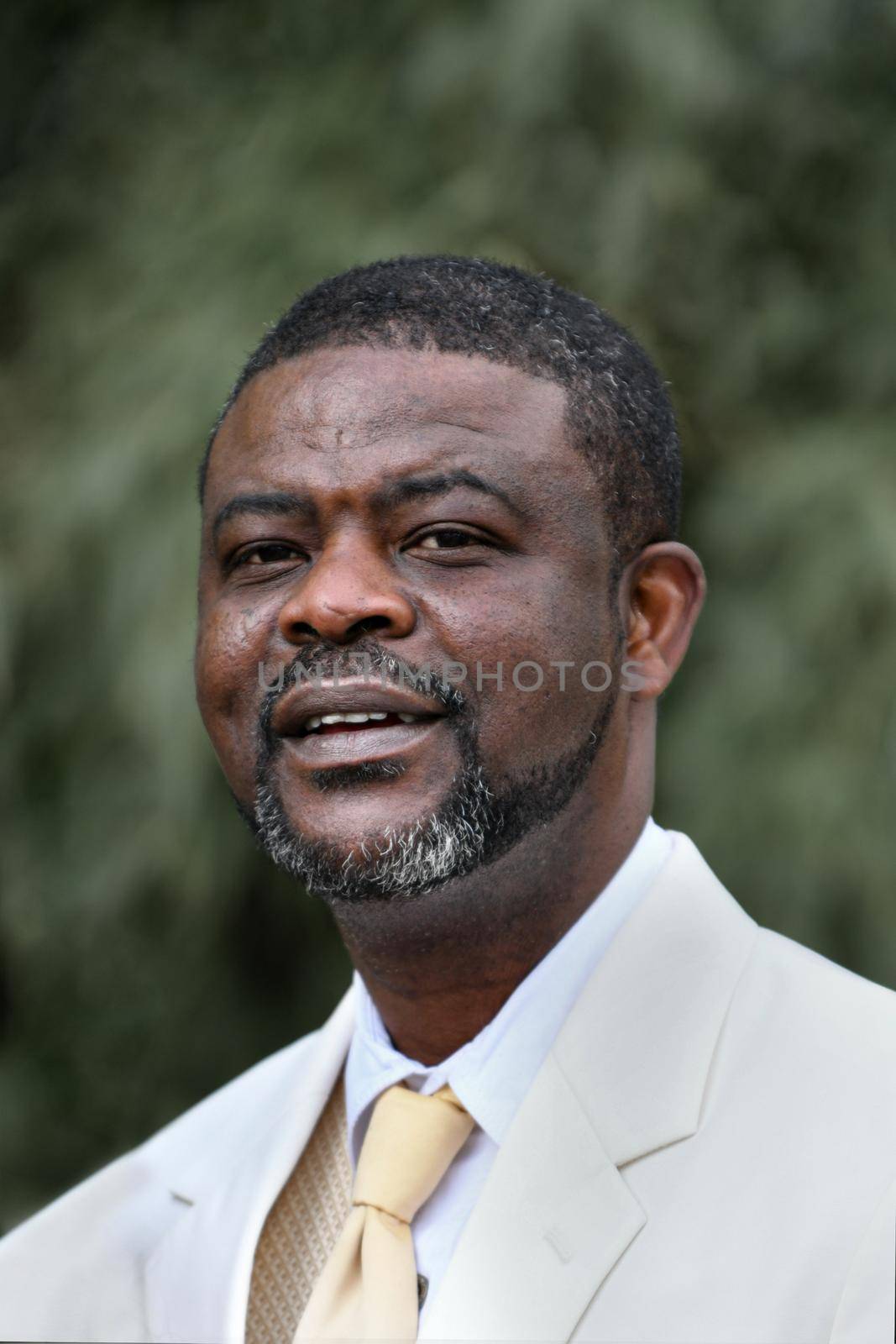 African man in white suit Groom at the wedding