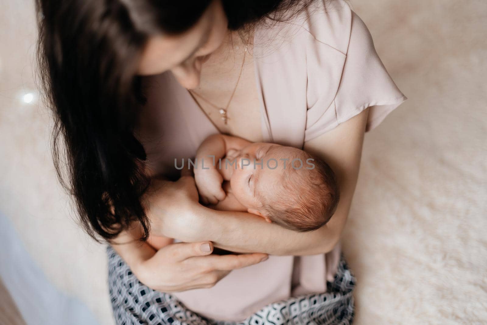 close-up. mom cradling a newborn baby. concept of motherhood.