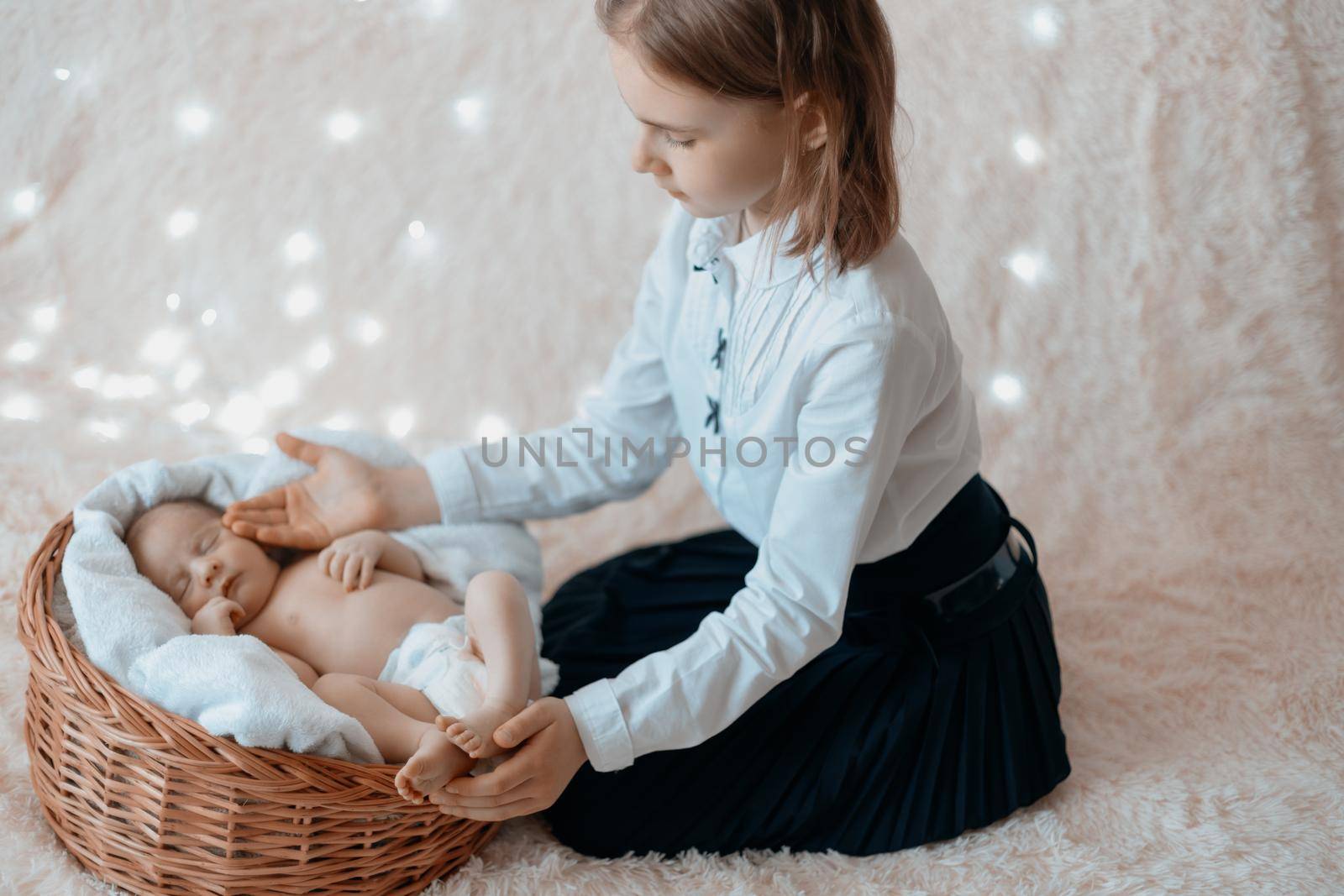 little girl caressing her newborn baby brother . concept of a happy family.