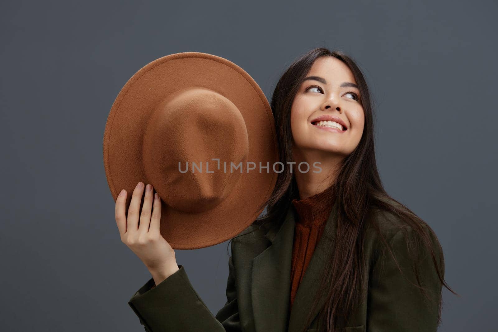 young woman brown hat hand gestures fashion emotions isolated background by SHOTPRIME