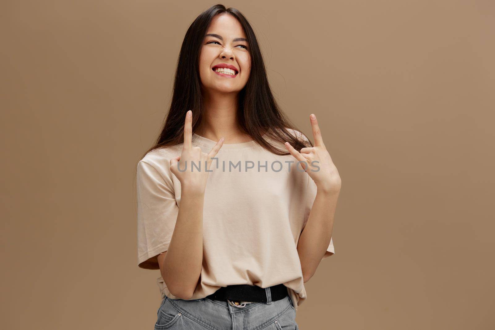 portrait woman in a beige T-shirt posing clothing fashion isolated background. High quality photo