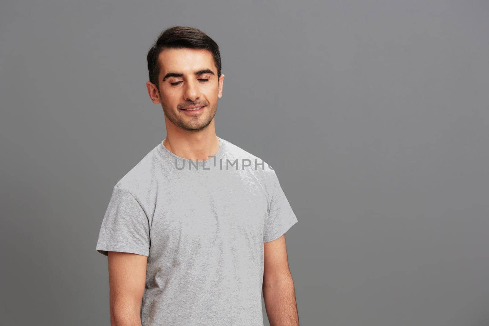 portrait man casual wear gray t-shirt fun fashion isolated background. High quality photo