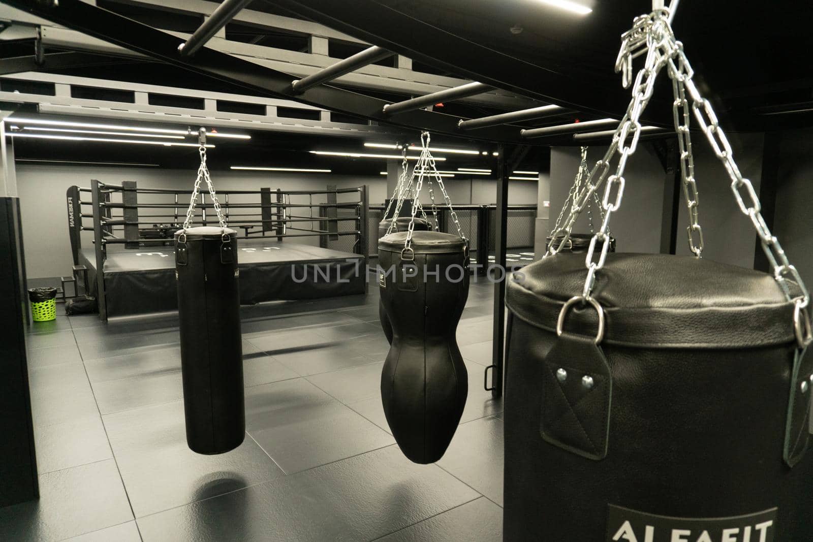 RUSSIA, MOSCOW - FEB 24, 2022: bag punching boxing boxer fist, In the afternoon power kick for fight from lifestyle heavy, kickboxing modern. Martial activity dark, aggression