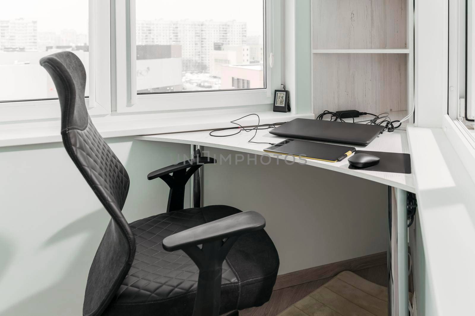 comfortable home workplace for freelance graphic designer or retoucher with graphic tablet