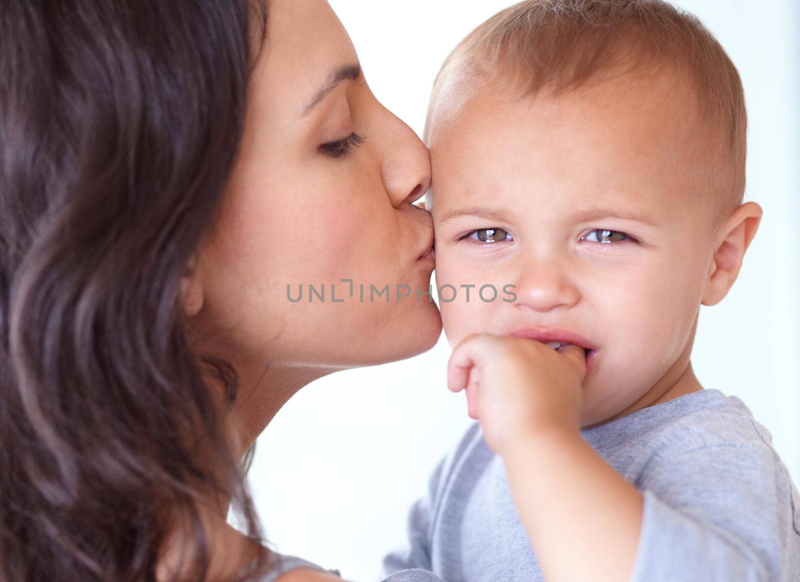 Cropped shot of a beautiful young woman and her baby at home.