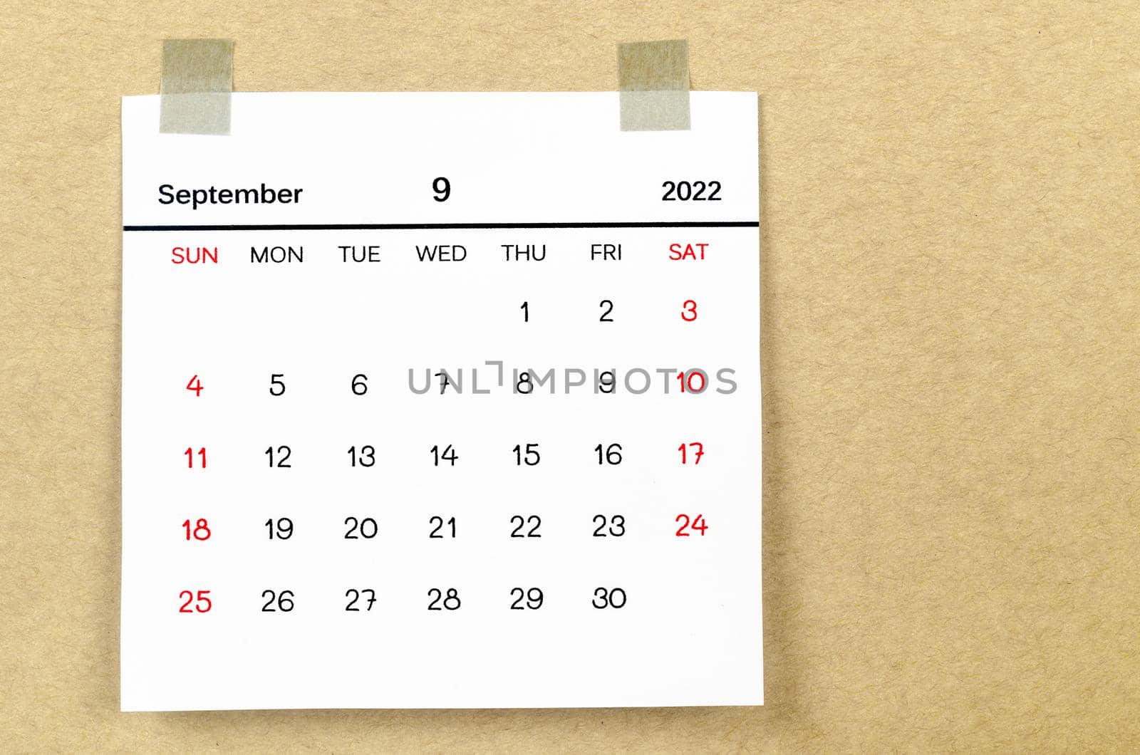 The September 2022 calendar on brown background.