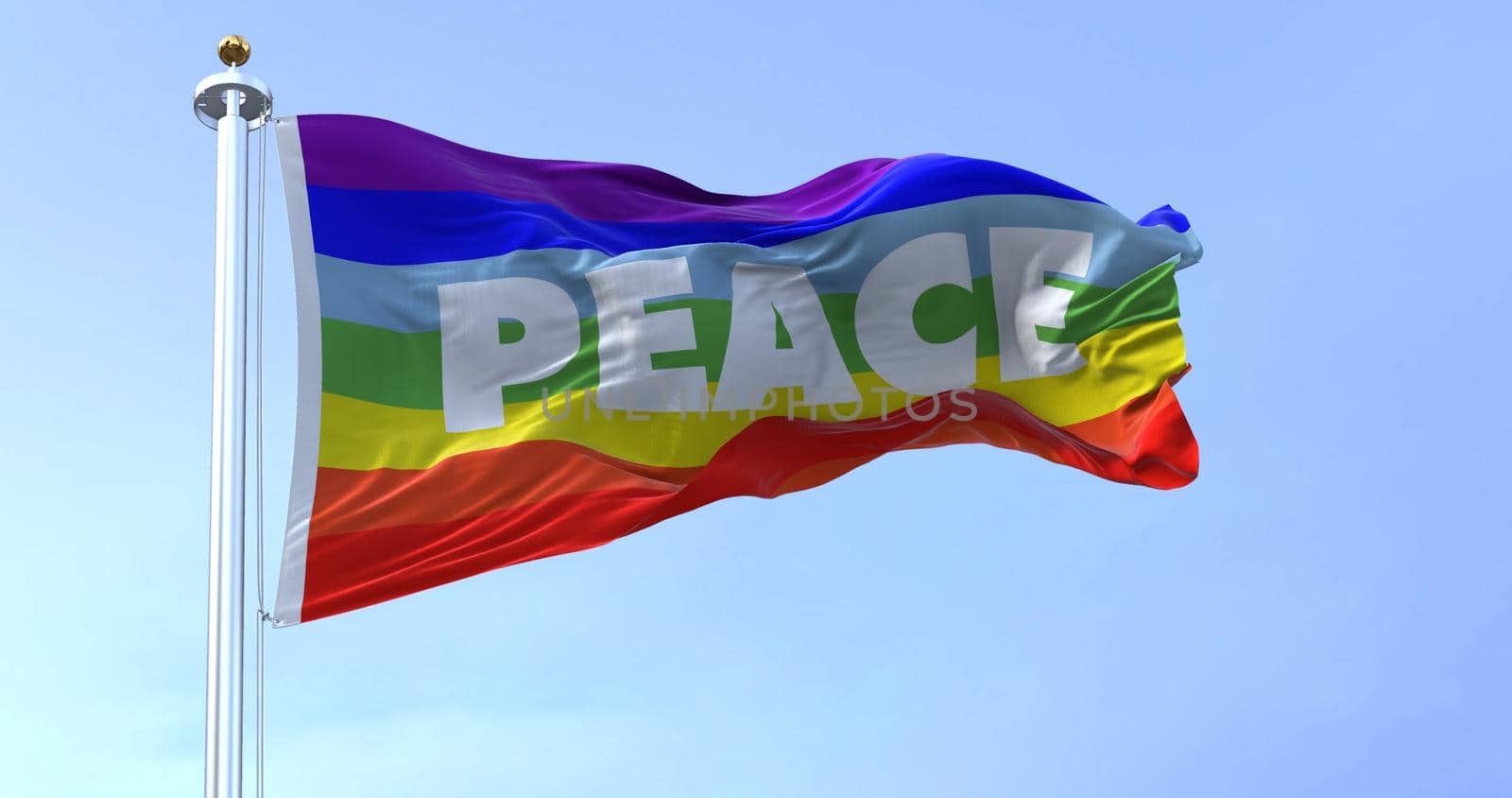the rainbow flag of peace flying in the wind. No war movement