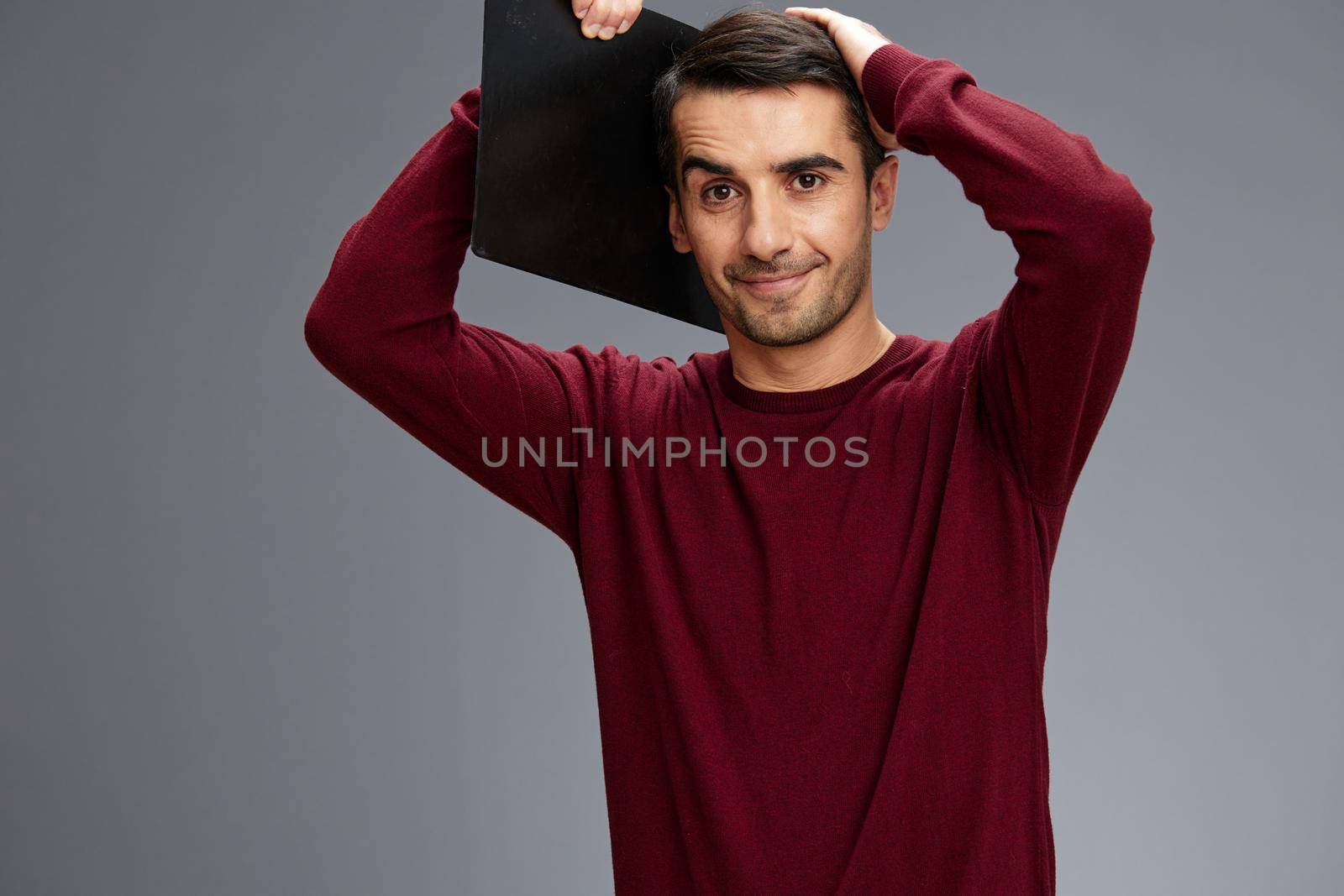 portrait man in a sweater posing documentation emotions isolated background. High quality photo