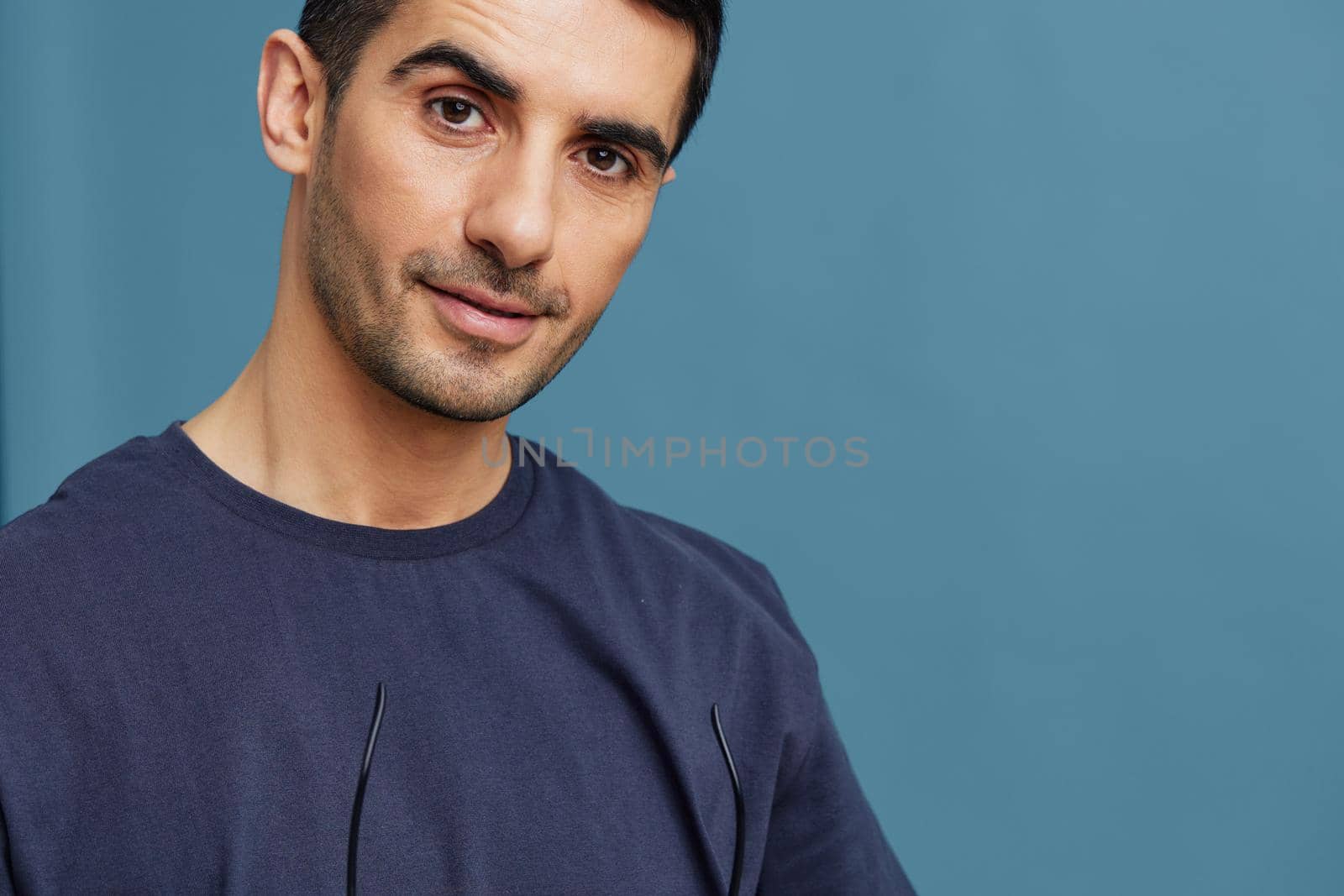 man in blue t-shirt portrait fashion close-up by SHOTPRIME