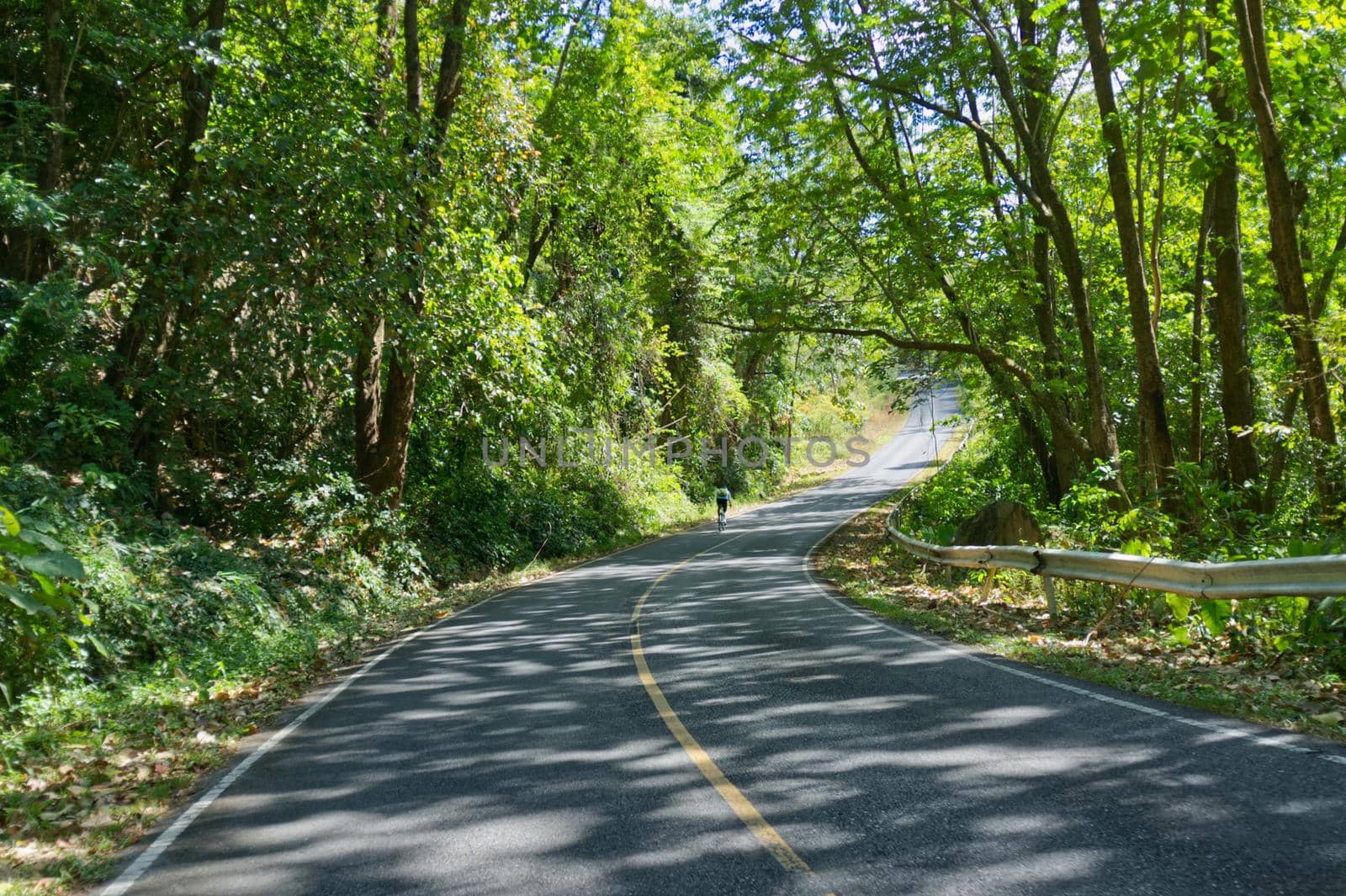 Man are cycling road bike in mountain road . KhaoYai, Korat, Thailand