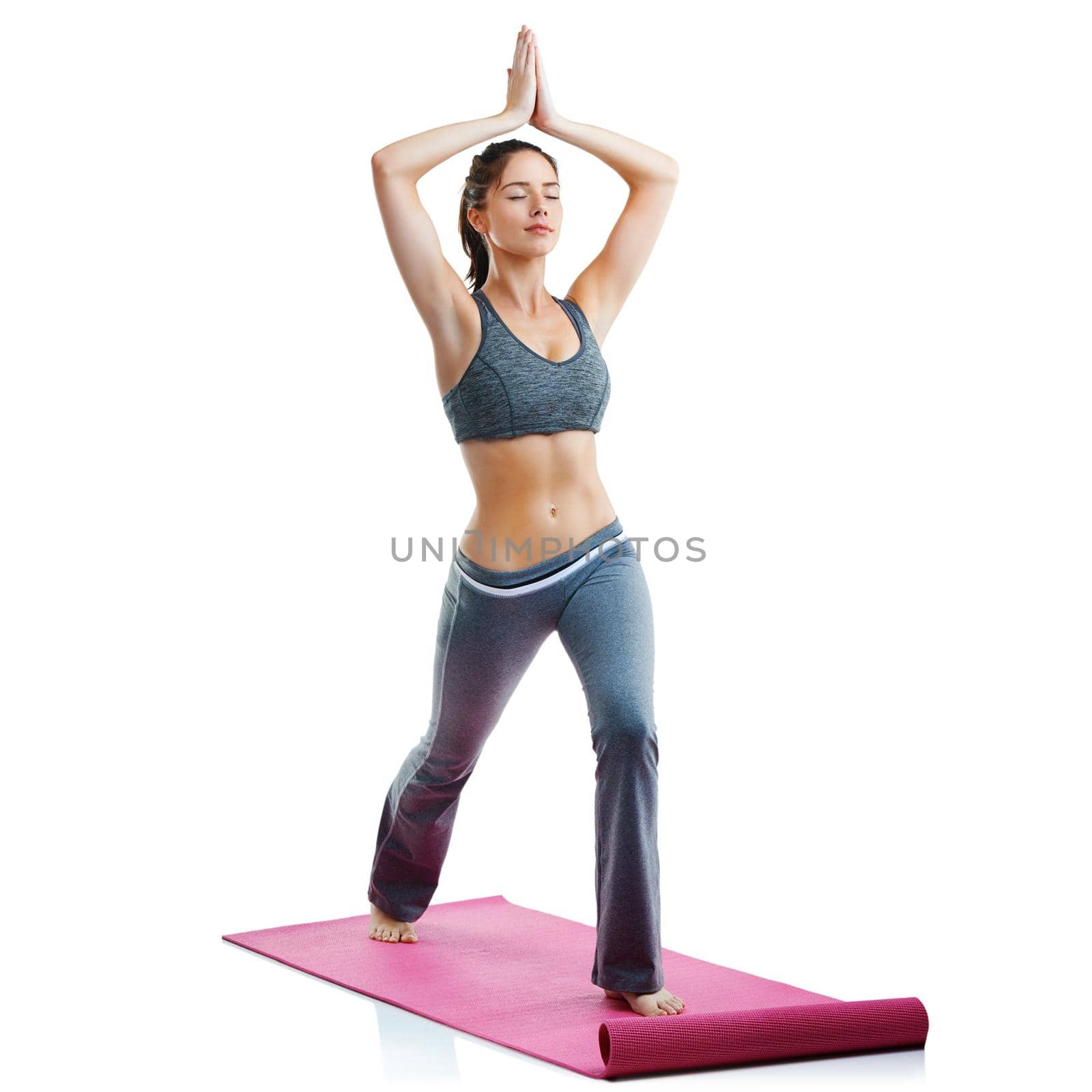 The body achieves what the mind believes. Studio shot of a fit young woman doing yoga isolated on white. by YuriArcurs