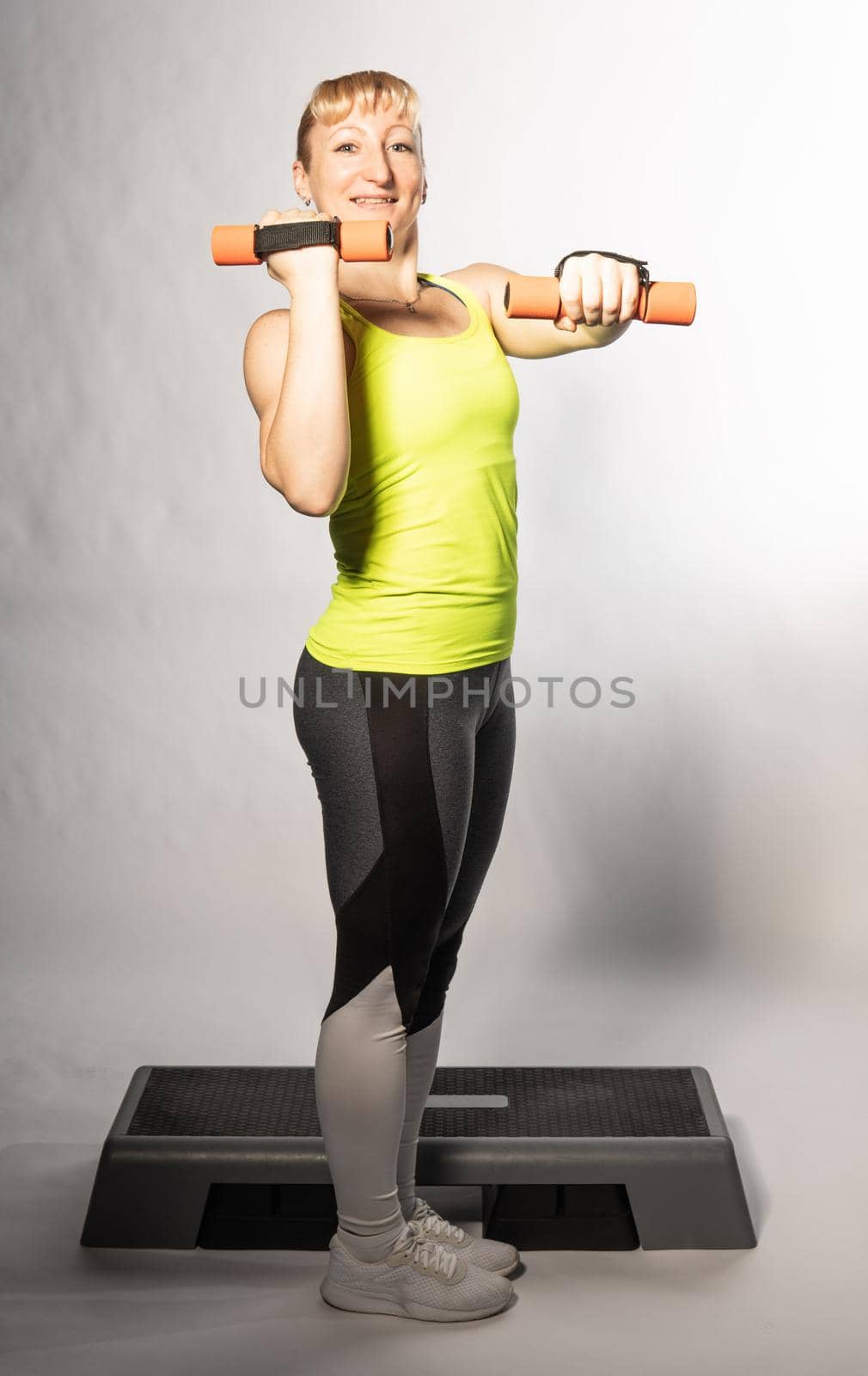 The girl is thin, the shadow is thick aerobics young step woman person, for exercise beauty from workout from happy healthy, class training. Ut active activity, step club smile caucasian woman the concept of a healthy lifestyle by 89167702191