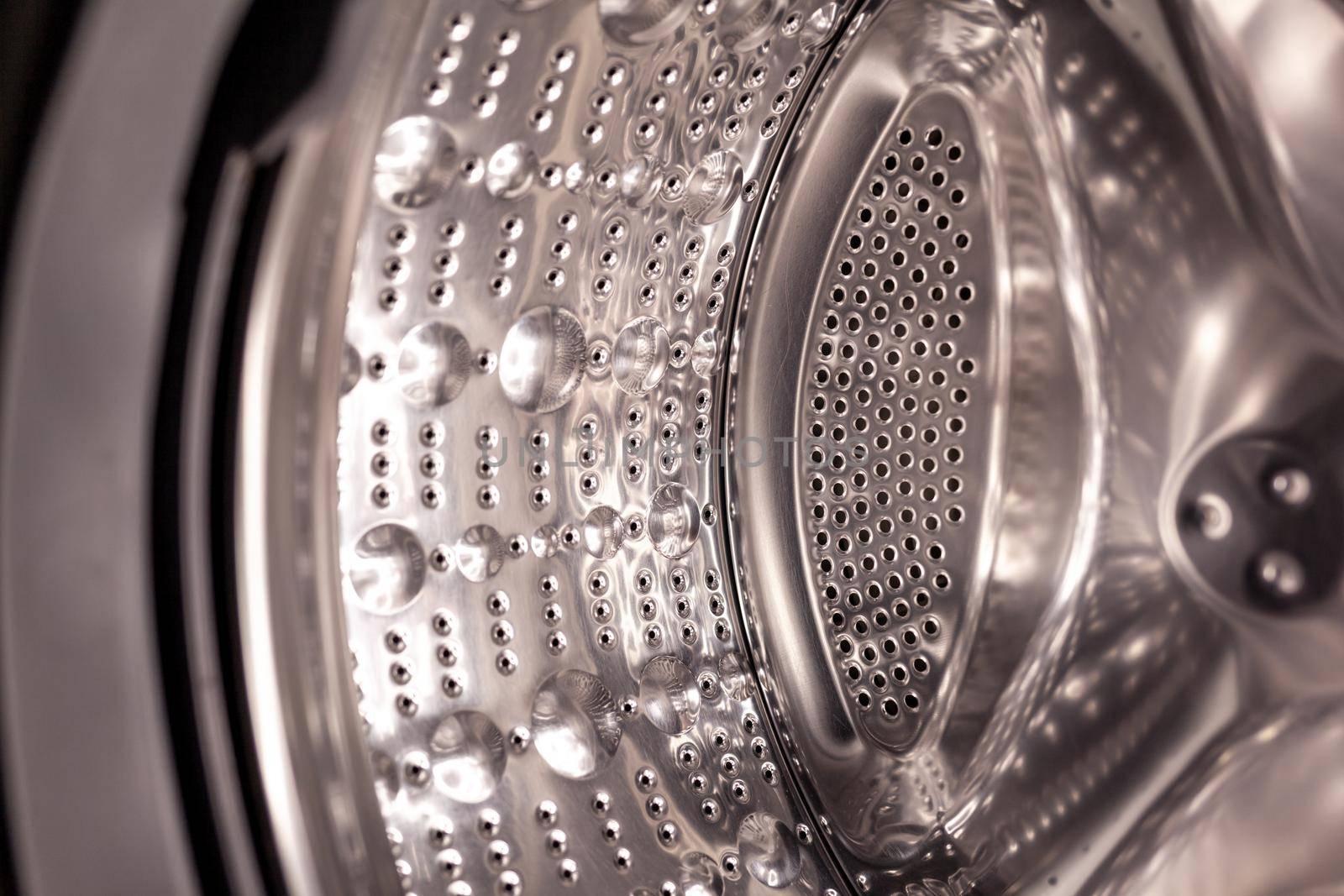 Drum of washing machine dry and clean close-up. Washing Dryer Machine inside view of a drum.