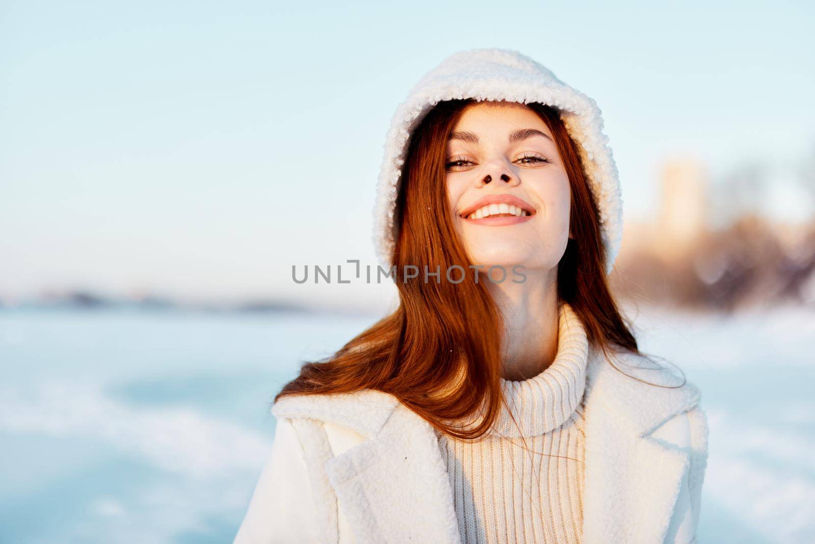 pretty woman red hair snow field winter clothes Fresh air. High quality photo