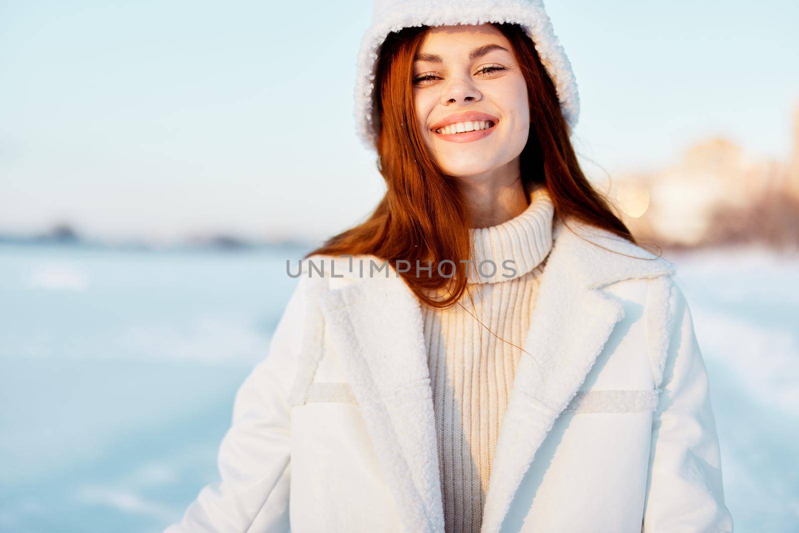 pretty woman red hair snow field winter clothes Fresh air. High quality photo