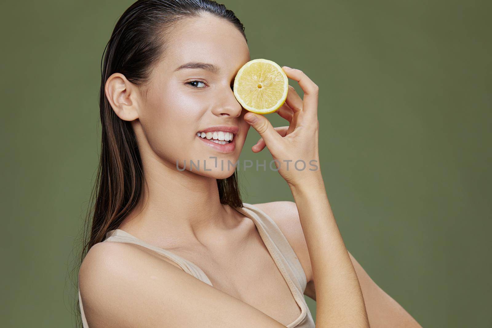 woman with lemon near face clean skin care health close-up Lifestyle. High quality photo