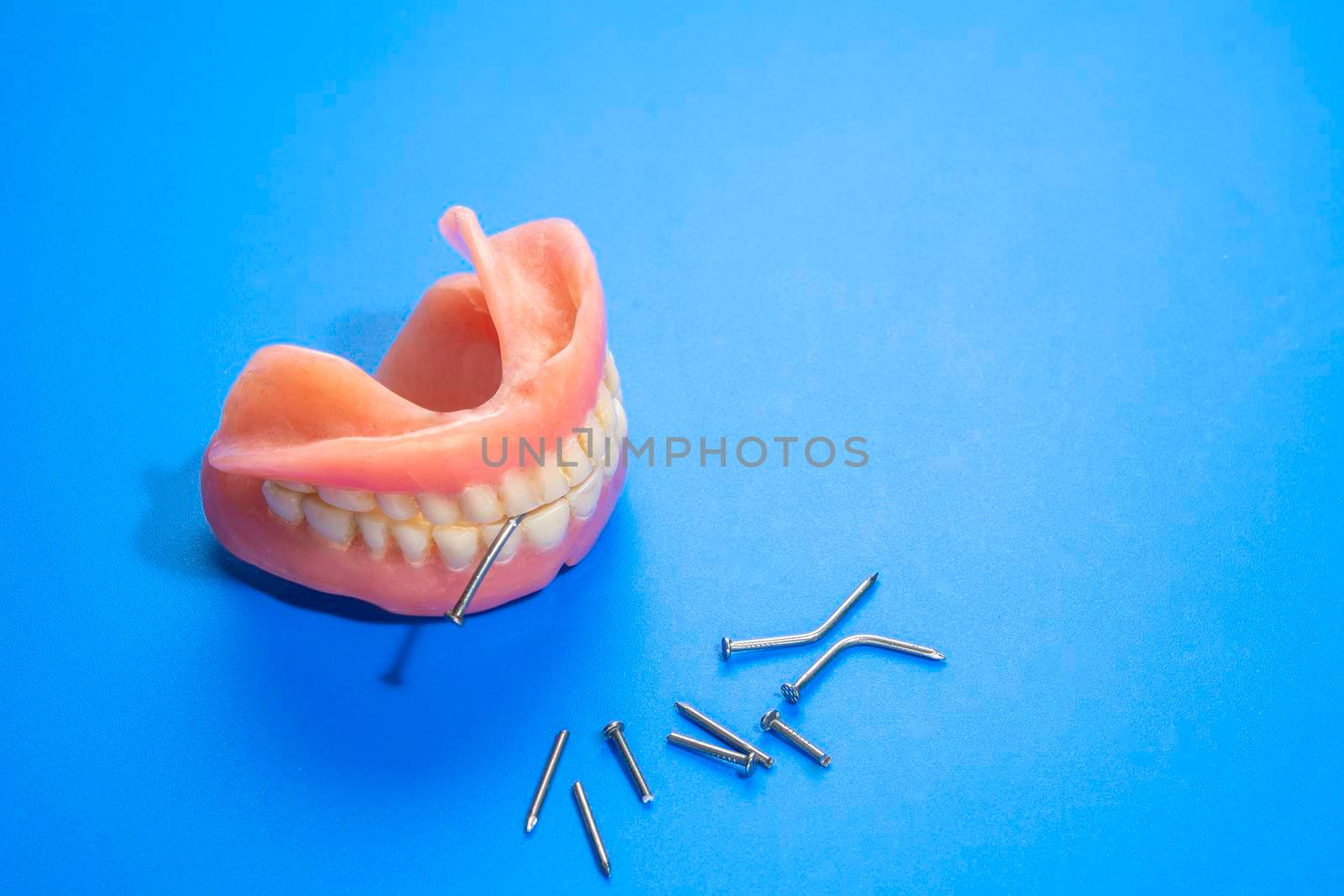 Dentures that bite through steel nails by ben44