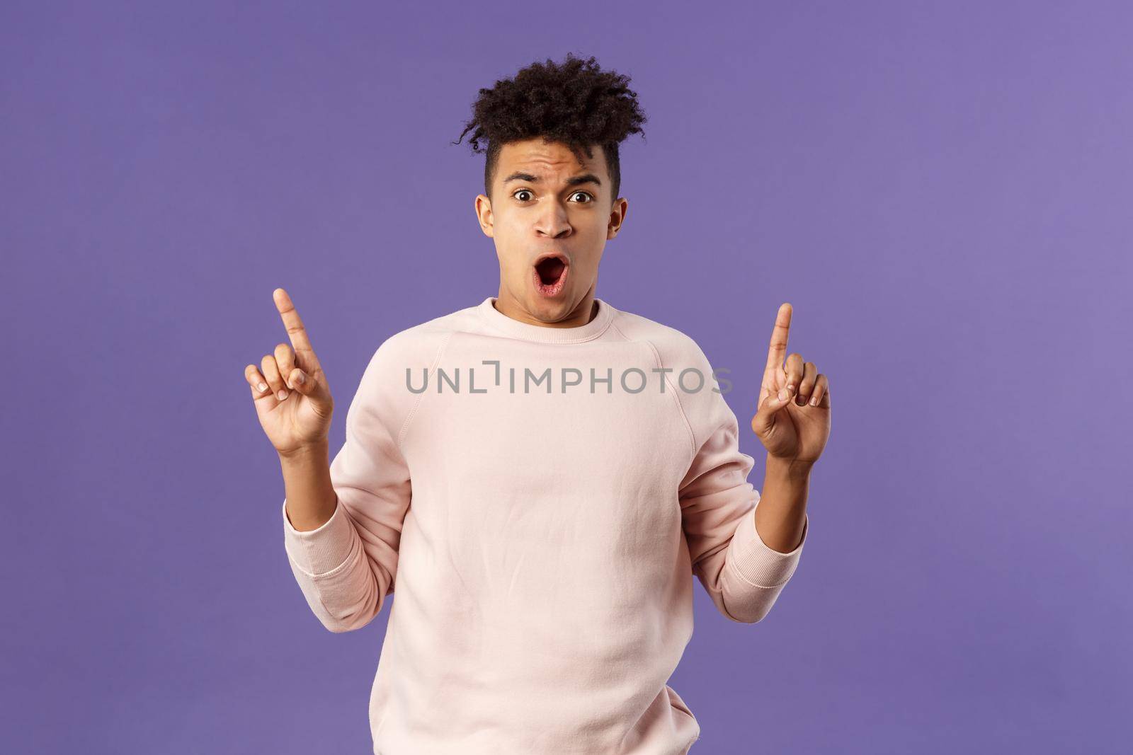 Portrait of shocked, speechless young hispanic man with dreads reacting to overwhelming shook news, gasping, drop jaw and staring concerned as pointing up at something astounding by Benzoix