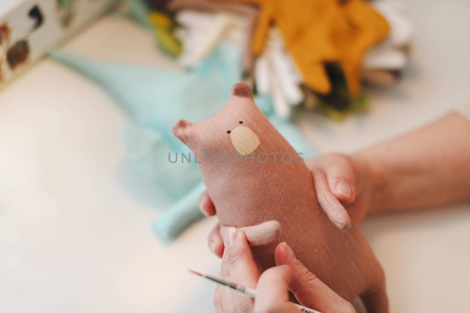process of making handmade toys. Handicraft, hobby, unique job concept by paralisart