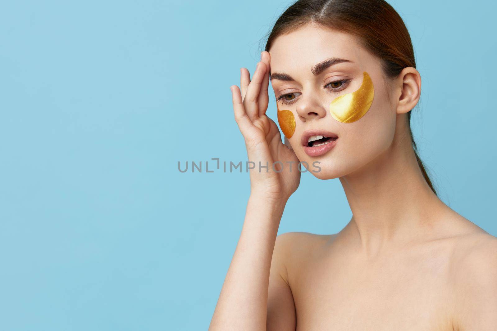 woman skin care face patches bare shoulders hygiene close-up Lifestyle. High quality photo