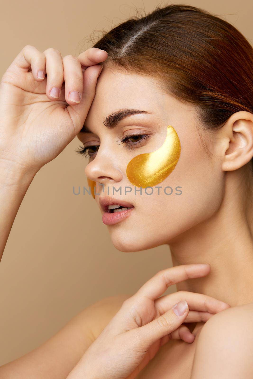 pretty woman gesturing with his hands skin care beige background. High quality photo