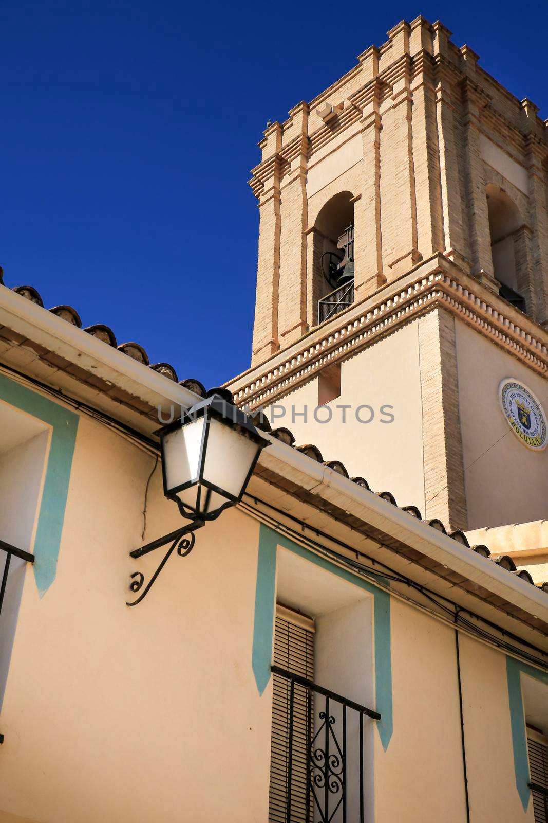 Facades of Bolulla village and San Jose church by soniabonet
