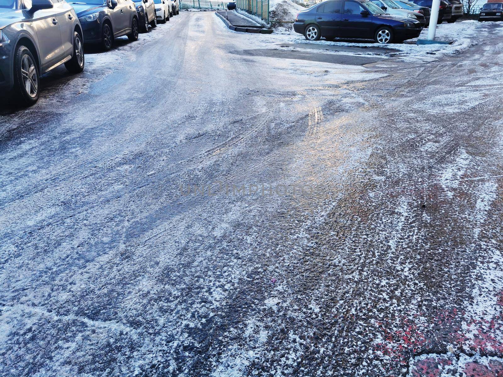 texture of asphalt road covered with ice, slippery road winter