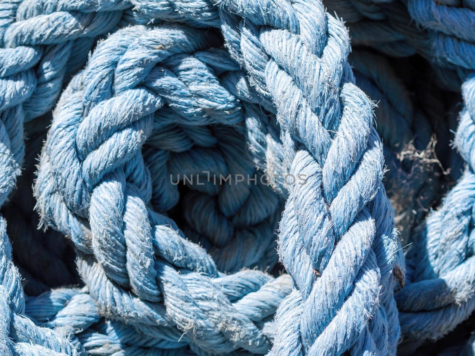 Close-up of an old frayed boat rope as a nautical background