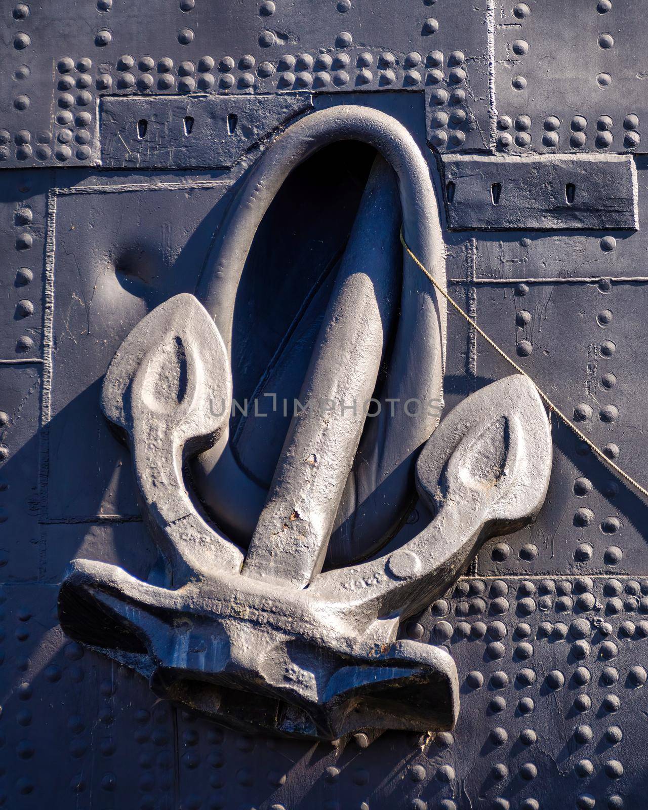 A heavy anchor holds a ship in one place