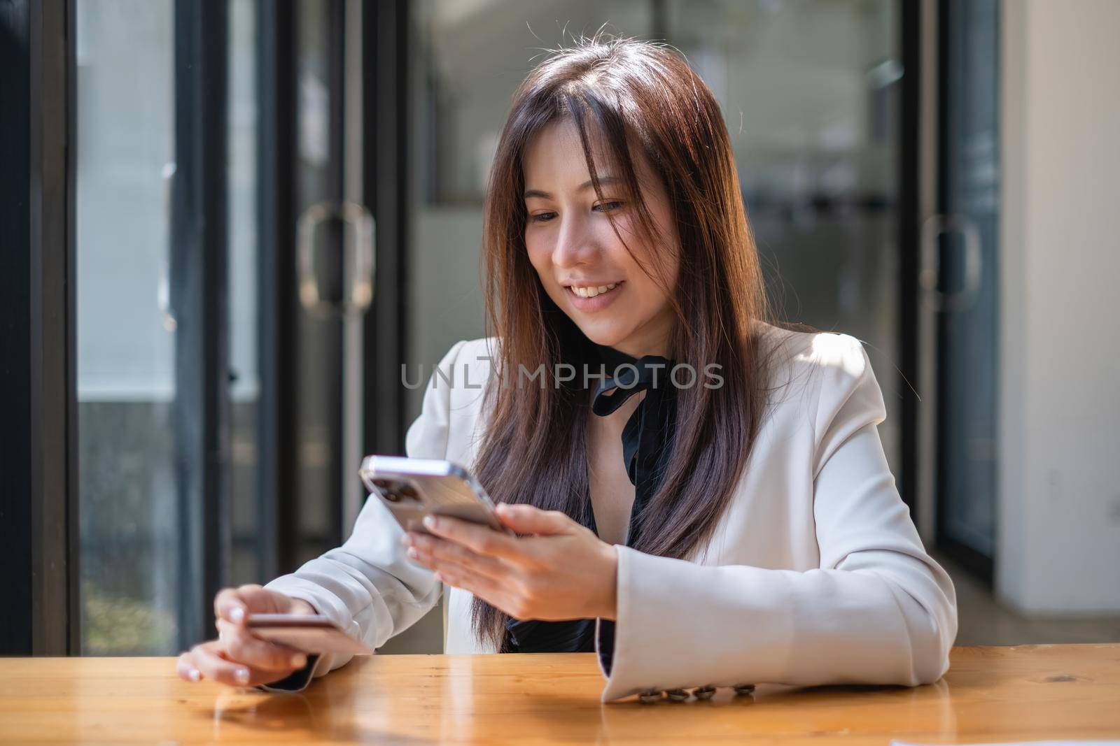 Woman enjoy with online shopping application and typing credit card for fill number to payment with virtual digital asset and metaverse