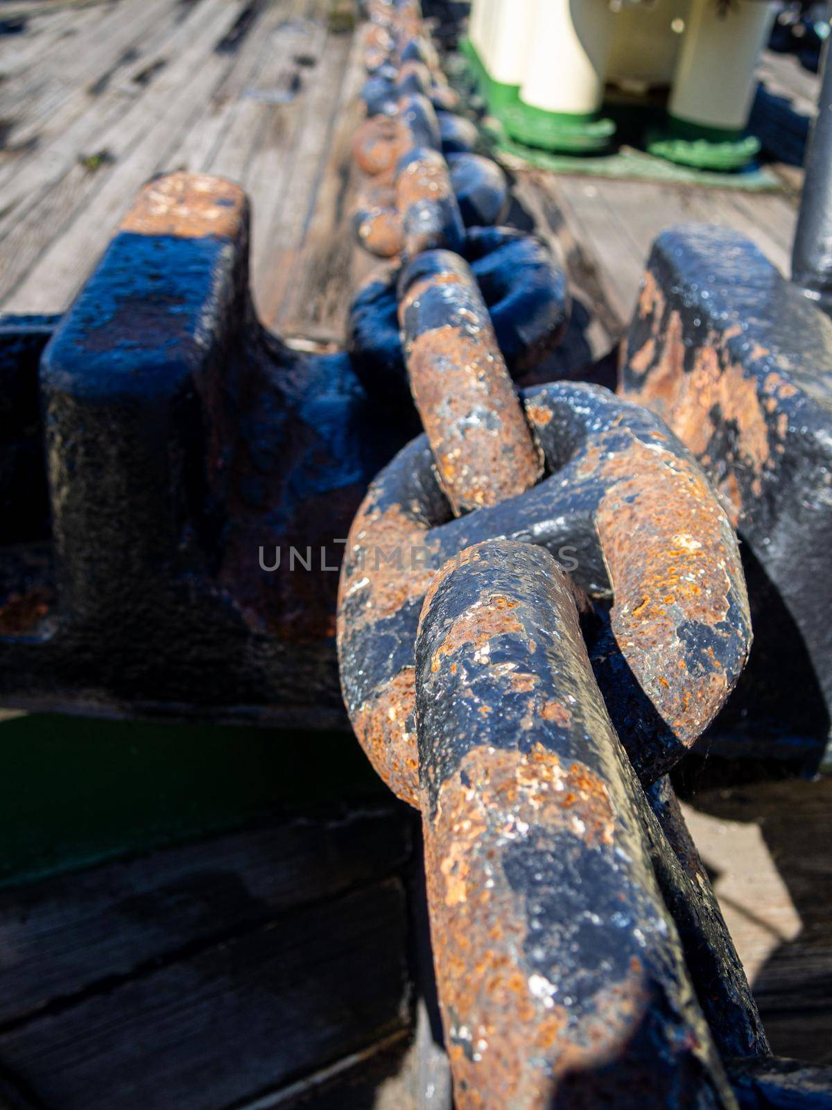 Large iron anchor chain. A rusty chain link. Corrosion.