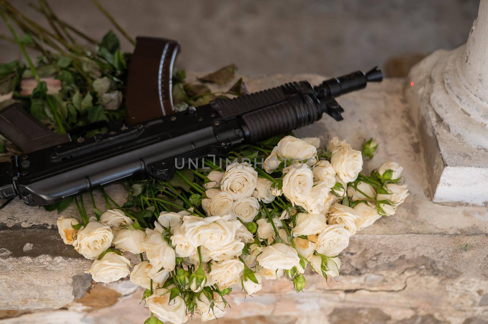 Automatic machine and a bouquet of small white roses