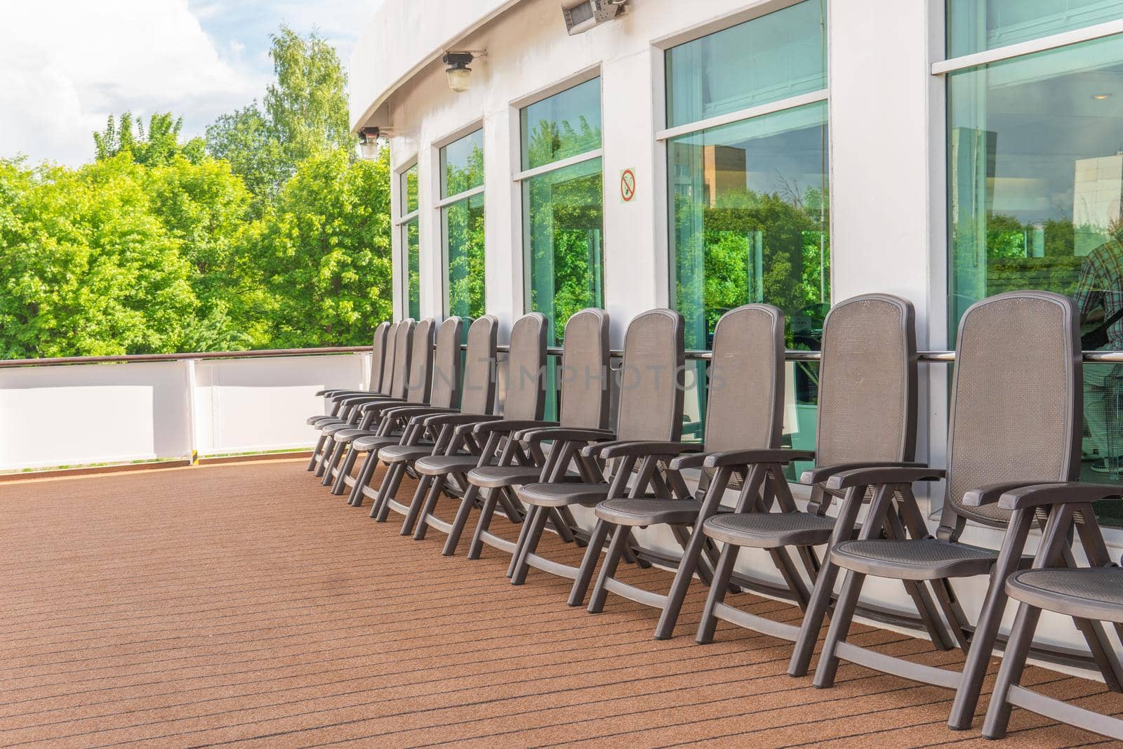 Chairs on deck brown plastic Ship circle yacht, vacation beautiful transportation ransportation friends, lifestyle bahamas. Bow shipboard carnival, hip tourists seascape cruise liner lifeboat lower deck drone