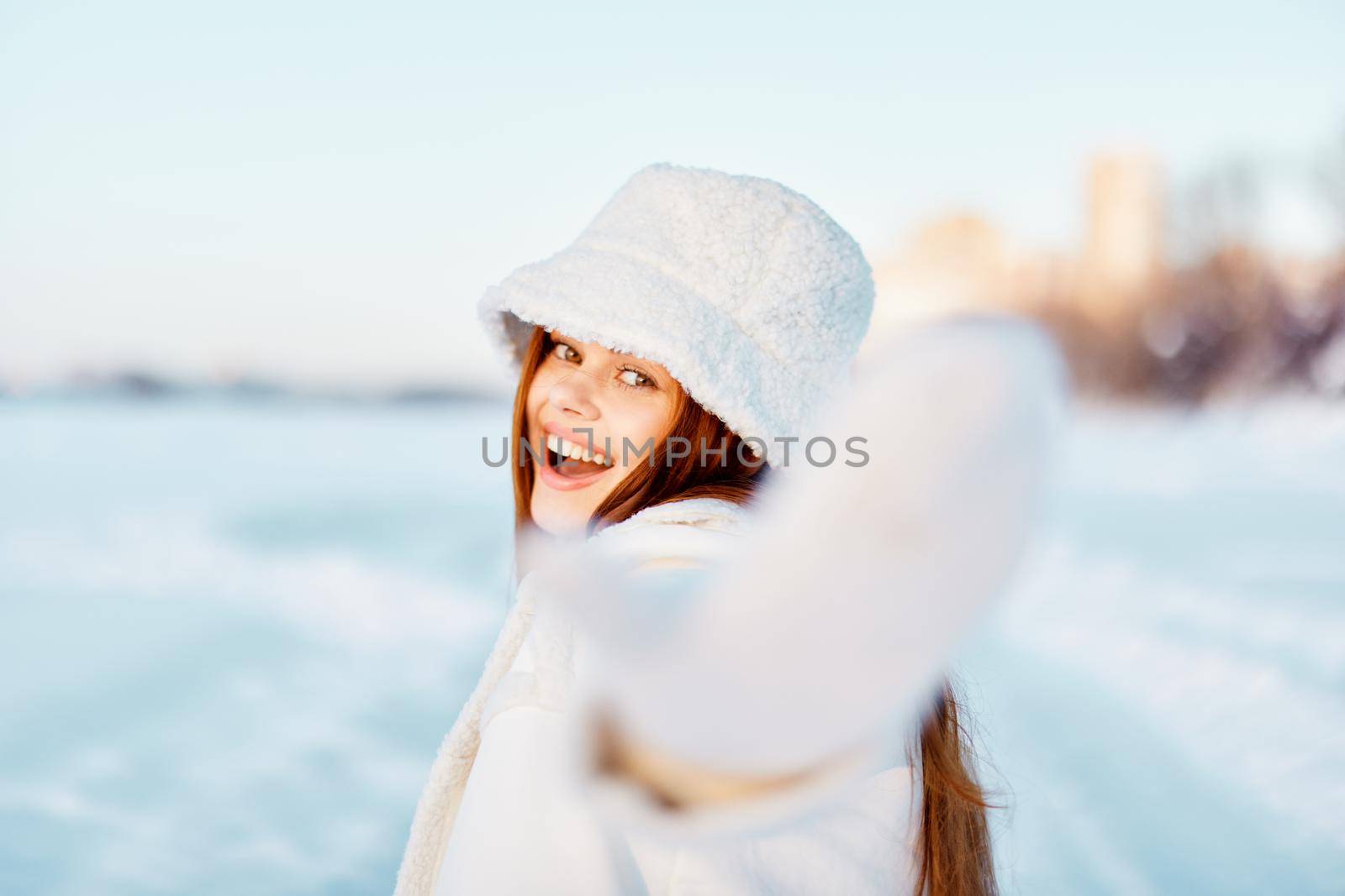 beautiful woman smile Winter mood walk white coat Fresh air. High quality photo