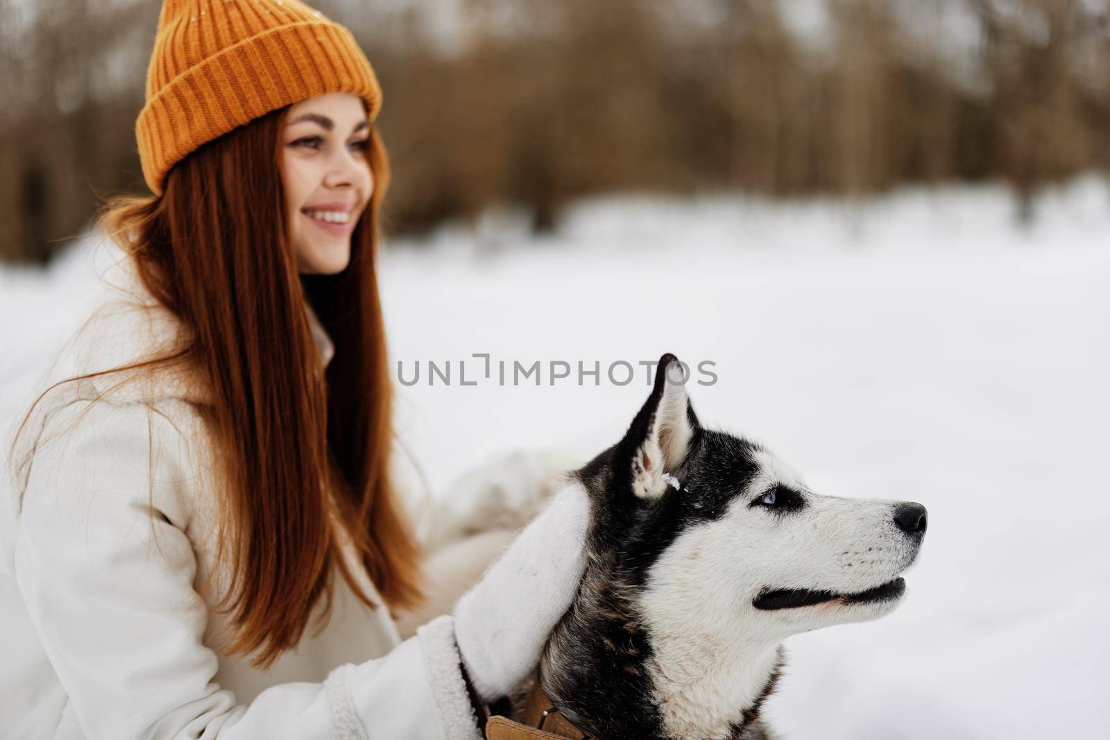 woman with dog outdoor games snow fun travel fresh air by SHOTPRIME