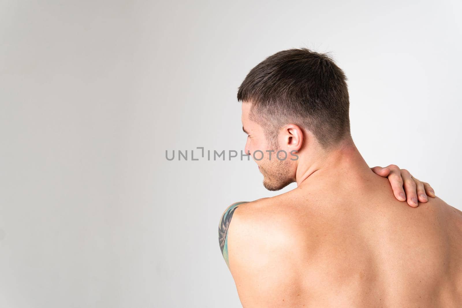 The muscles of the neck in a man on a white background are hurt back hurt injury, sick white medical, illness Hold neck sickness, problem suffer attractive