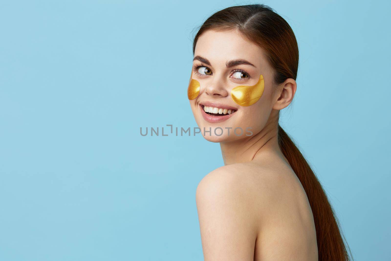 portrait woman skin care face patches bare shoulders hygiene isolated background. High quality photo