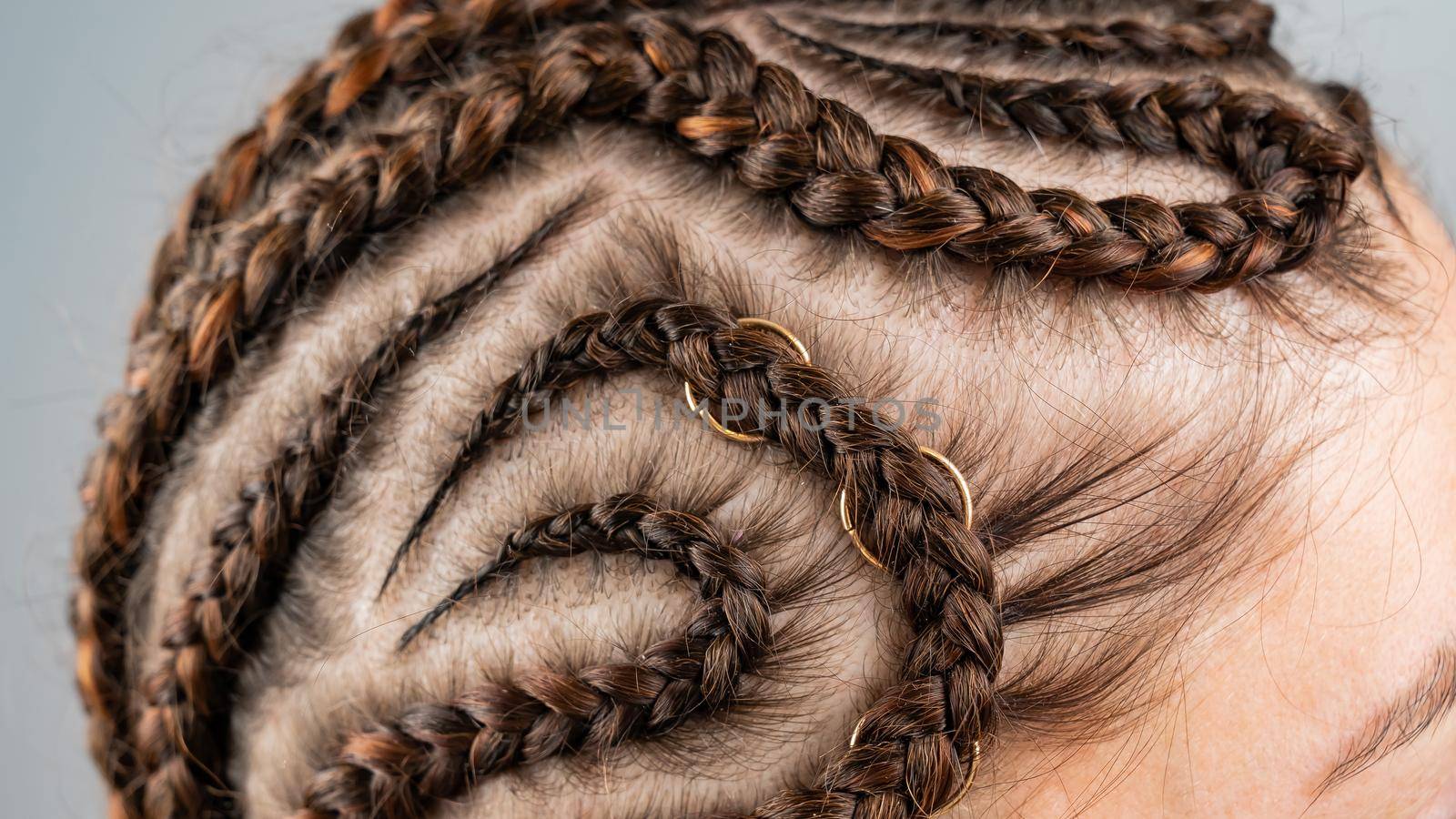 Close-up of braids on the head of a caucasian woman. by mrwed54