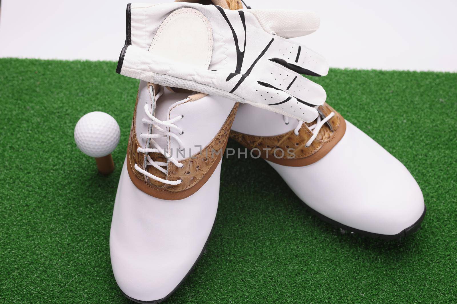 Golf set, stylish white leather boots with brown golf inserts, ball and gloves by kuprevich