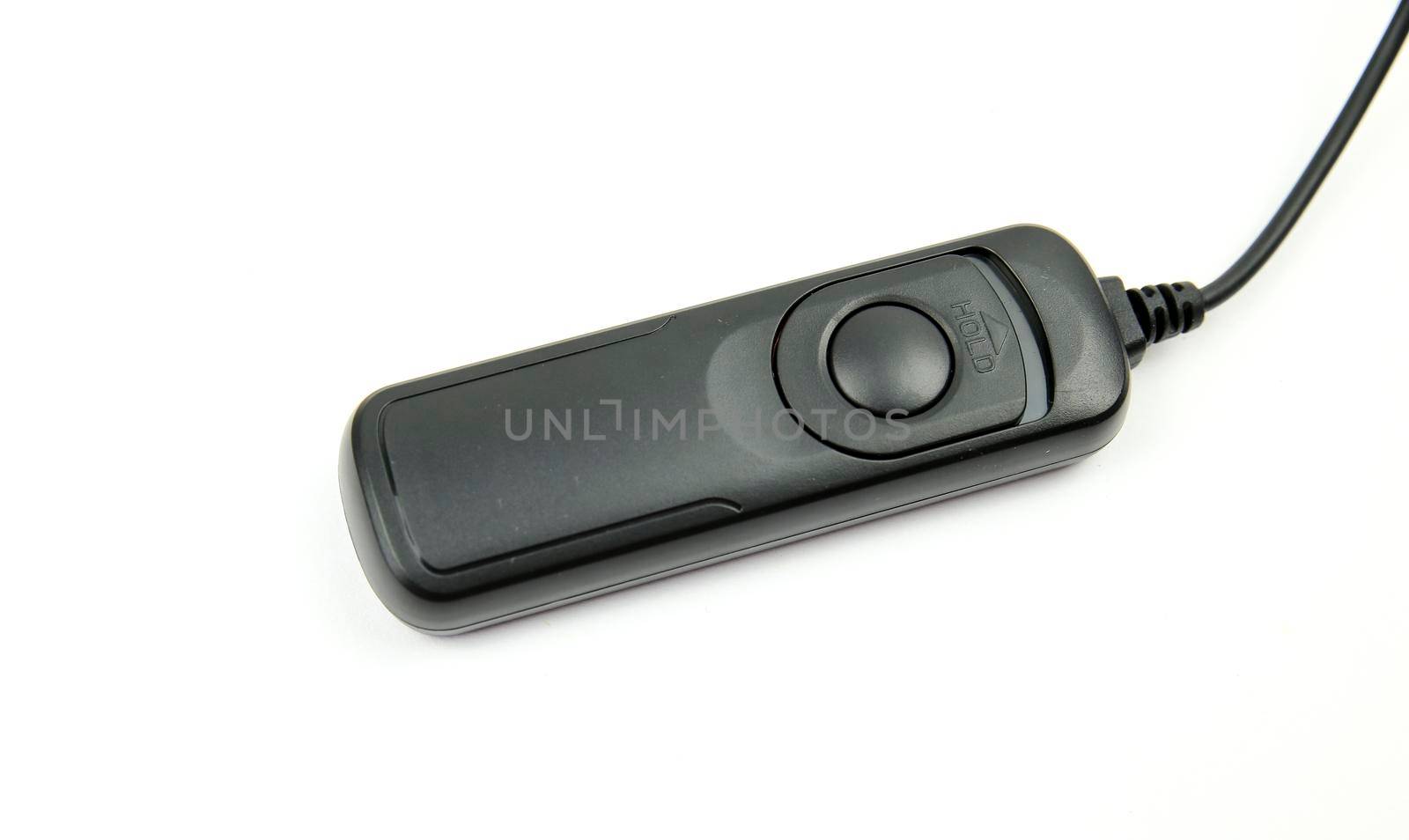 Black remote shutter release on white background