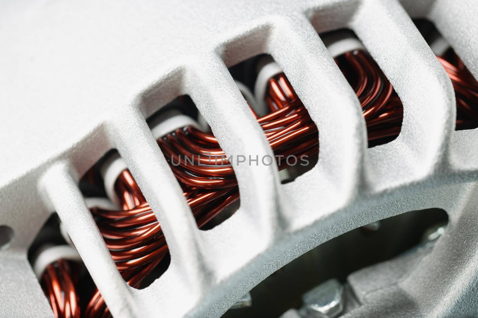 Close-up of electric motor stator, winding coil, electric induction motor under repairing, armature detail. Fixation, repair, replacement, detail concept