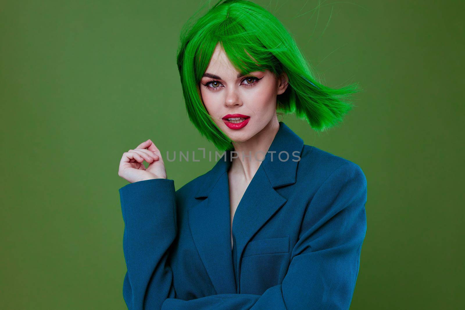 Beautiful fashionable girl attractive look green wig blue jacket posing color background unaltered by SHOTPRIME