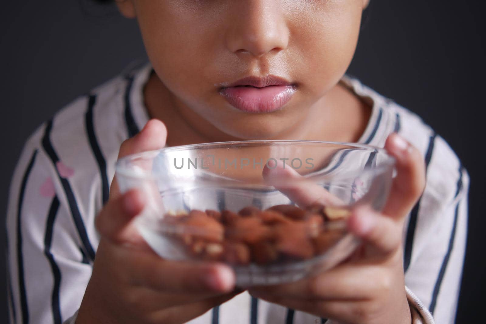 Close up of almond nuts in a bowl .