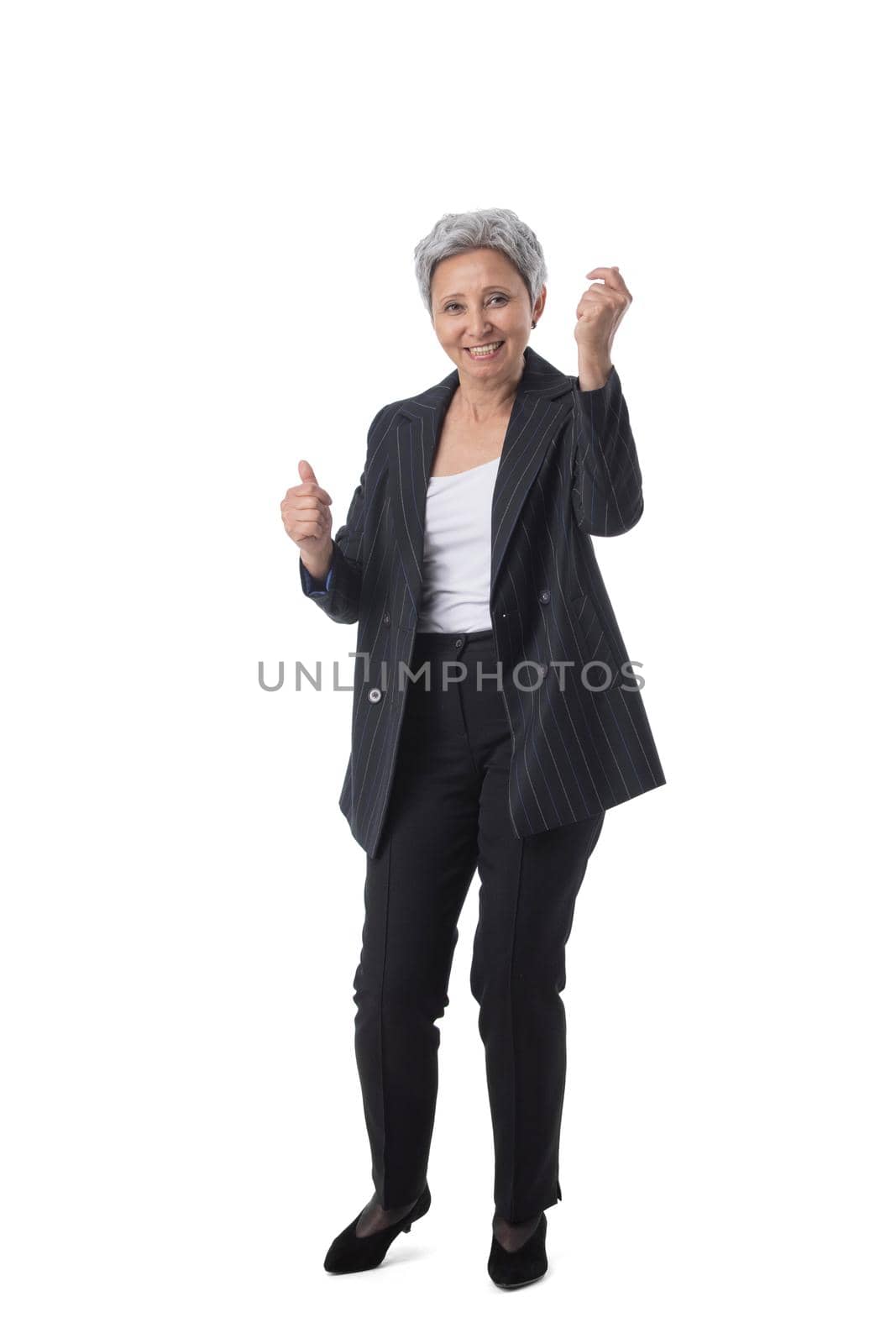 Full length portrait of senior asian business woman holding fists isolated on white background