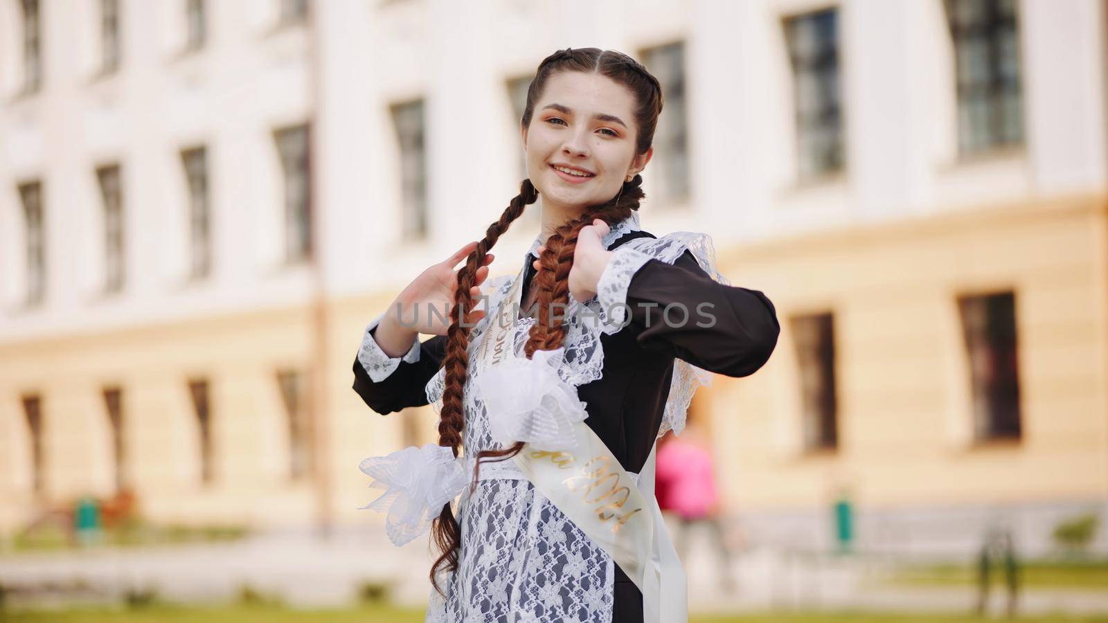 Happy Russian schoolgirl on the last day of school. by DovidPro