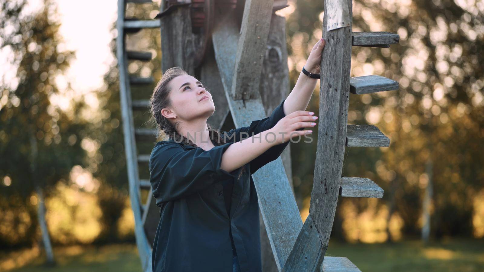 A young girl poses at the old mill